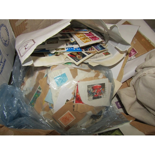 311 - A box of miscellaneous stamps, many from torn envelopes, mainly mid-20th century and later, a quanti... 