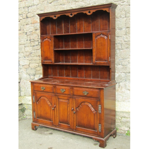 2690 - A good quality reproduction oak dresser in the Georgian manner, the base with two arched and panelle... 