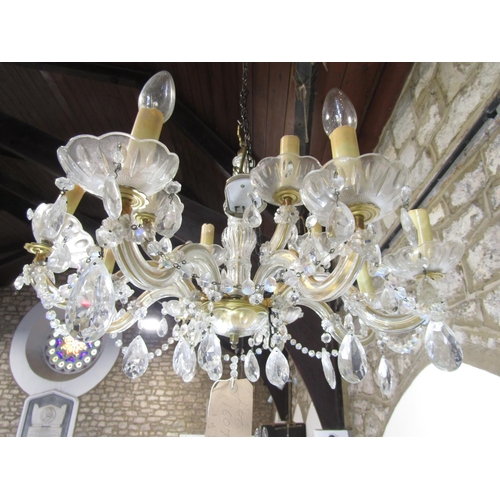 1607A - A cut glass 12 branch chandelier with festoon drops and a further 8 branch example 92)