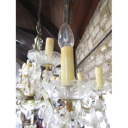 1607A - A cut glass 12 branch chandelier with festoon drops and a further 8 branch example 92)