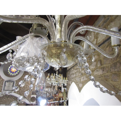 1607A - A cut glass 12 branch chandelier with festoon drops and a further 8 branch example 92)