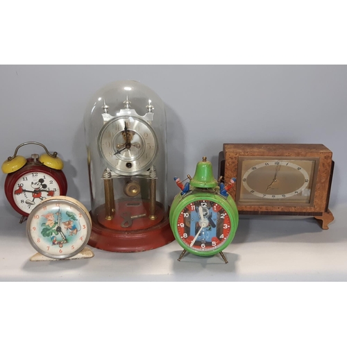 1403 - Three vintage alarm clocks, an Ingersoll mantle clock, art deco, in figured walnut case and a furthe... 