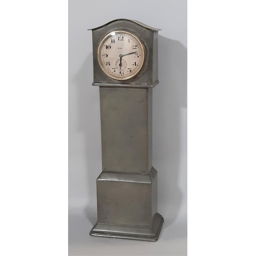 1404 - A miniature pewter longcase clock with eight day time piece