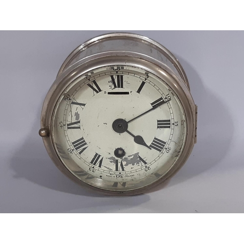 1405 - A marine or bulk head clock in a plated case work with eight day time piece