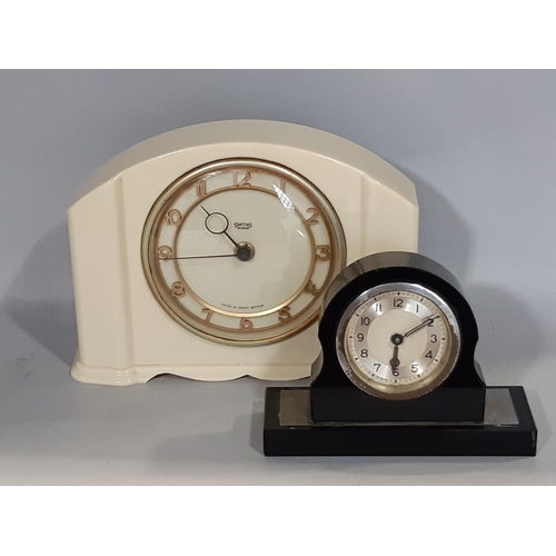 1406 - An art deco bedside clock with eight day time piece, together with one other by Smith's in a white p... 