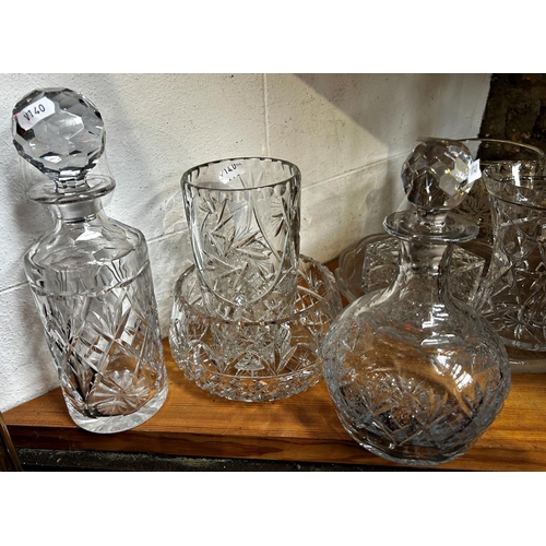 1166 - A large quantity of mixed glassware, decanters, bowls, wine glasses, vases, finger bowls, etc