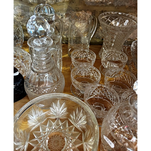 1166 - A large quantity of mixed glassware, decanters, bowls, wine glasses, vases, finger bowls, etc