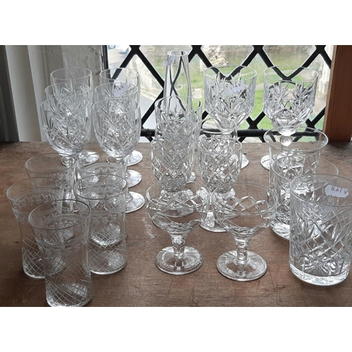 1150 - A mixed selection of fine cut glassware, with slender wine glasses with faceted stems and other glas... 