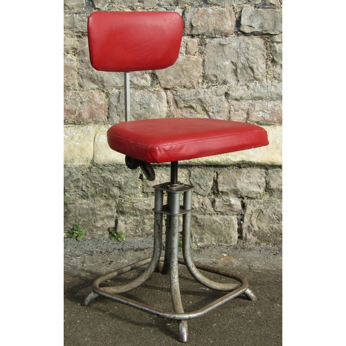 2084 - A vintage industrial swivel height adjustable office/typists chair with red vinyl upholstered seat a... 