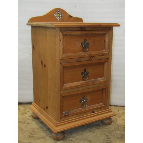 2207 - A pair of stripped pine bedside cupboards, each enclosed by a fielded panelled door and frieze drawe... 