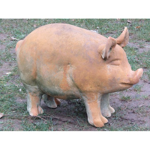 2087A - A weathered clay garden ornament in the form of a standing pig, 43cm H x 62 cm L approx