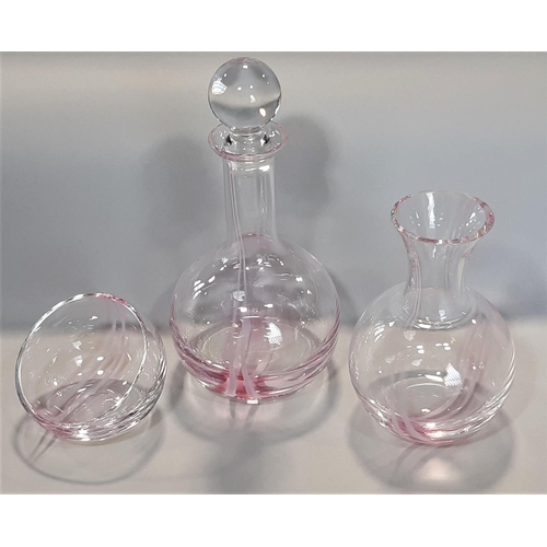 1130 - A Caithness pink decanter, carafe, bowl and a suite of 18 Dartington glasses comprising 12 flutes , ... 