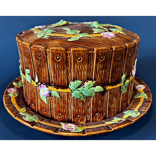 1029 - A large majolica cheese dome with wood effect decoration and floral garlands (af, handle to top of d... 