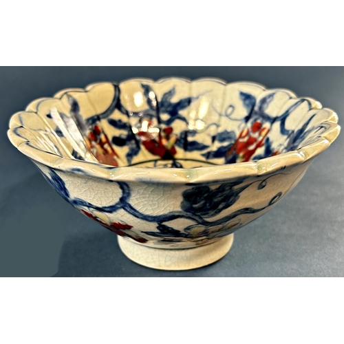 1041 - Chinese lobed bowl in under-glazed blue and red with grape and leaf decoration and seven character m... 