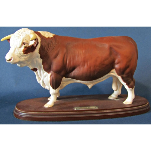 1060 - A Royal Doulton figure of a Hereford bull on a wooden plinth, height 18.5cm and a black Beswick hors... 