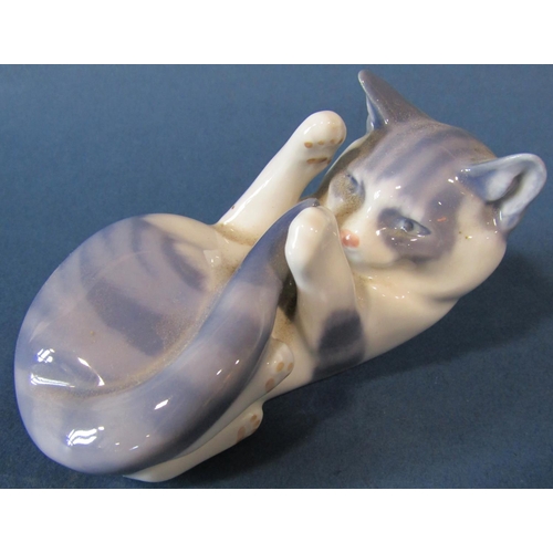 1072 - Three Royal Crown Derby ceramic cat figures together with a further Copenhagen example