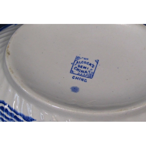 1091 - A collection blue and white Alcock's Semi-China 'willow' type pattern dinner wares comprising a grad... 