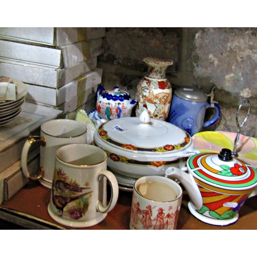 1094 - A collection of ceramics to include a teapot in the Clarice Cliff style, a stoneware stein with pewt... 