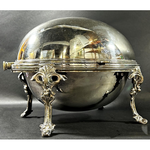 1203 - A Victorian silver plated roll top Bain Marie tureen complete with drainer raised on four scrolled s... 