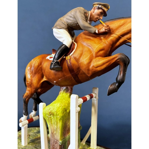 1084 - A Royal Worcester figure of General Raimondo D'Inezo, on horseback jumping a hurdle (af)