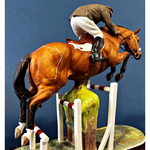 1084 - A Royal Worcester figure of General Raimondo D'Inezo, on horseback jumping a hurdle (af)