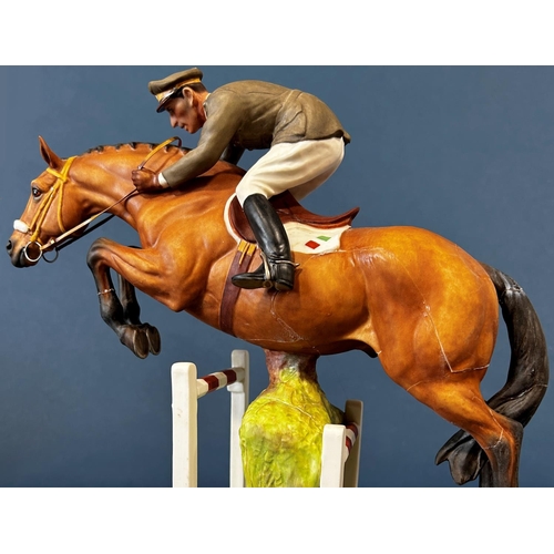 1084 - A Royal Worcester figure of General Raimondo D'Inezo, on horseback jumping a hurdle (af)