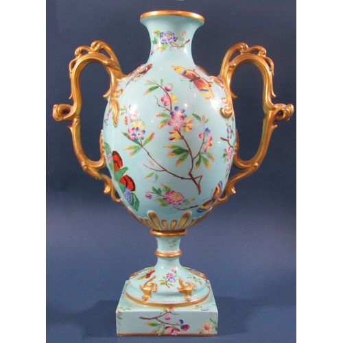 1079 - A Victorian oviform vase in turquoise with panelled detail showing butterflies, moths, floral sprays... 