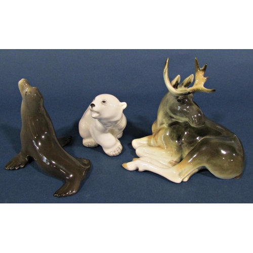 1108 - Five Russian porcelain figures to include two Inuit characters, polar bear, seal and mousse