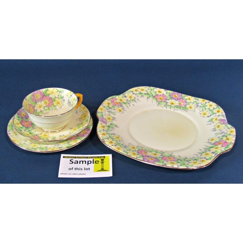 1124 - A collection of Crown Staffordshire tea ware in the Primrose pattern comprising ten trios and a sand... 