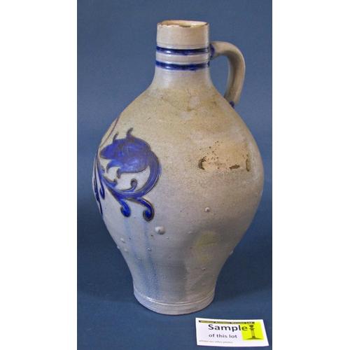 1128 - A Berlin stoneware flagon with incised floral detail, further salt glazed oviform jug with loop hand... 