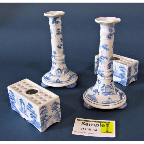 1133 - A collection of contemporary Isis hand painted blue and white pottery comprising two flower bricks, ... 