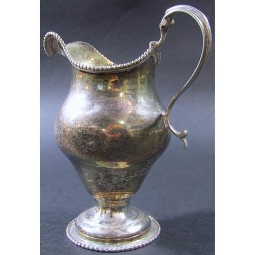 1224 - A George III silver gilt beaded cream jug, London 1774, maker Ann Chesterman, 13cm tall, 3oz approx