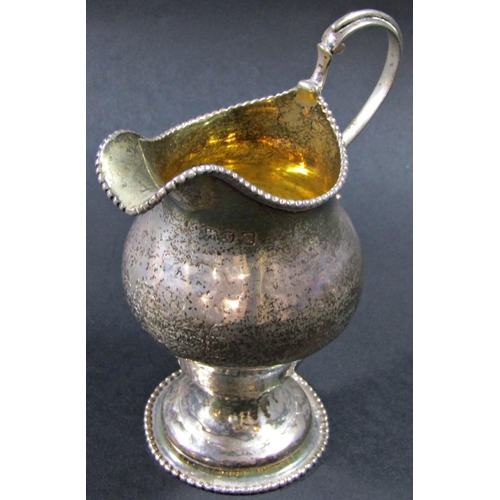 1224 - A George III silver gilt beaded cream jug, London 1774, maker Ann Chesterman, 13cm tall, 3oz approx