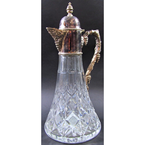 1226 - A Warwickshire reproduction silver ornate Georgian style claret jug with a grapevine twisted handle,... 