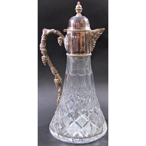 1226 - A Warwickshire reproduction silver ornate Georgian style claret jug with a grapevine twisted handle,... 