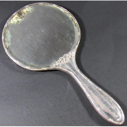 1229 - A set of five silver backed hand mirror and brush set