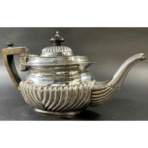 1219 - An early 20th century gadrooned silver teapot, Birmingham 1912, maker William Devenport, 12.6oz all ... 