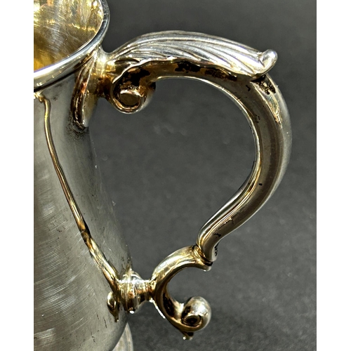 1223 - A George II silver baluster shaped tankard with scrolled handle, monogrammed London 1757, maker Thom... 