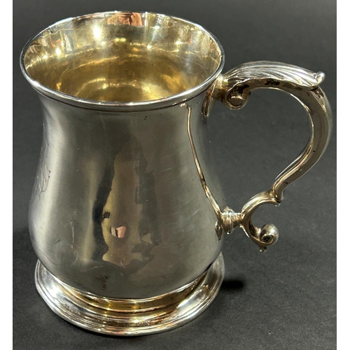 1223 - A George II silver baluster shaped tankard with scrolled handle, monogrammed London 1757, maker Thom... 