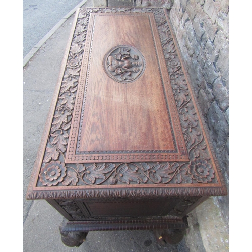 2630 - A 19th century Anglo Indian hardwood chest on stand, with rising lid and repeating carved foliate de... 