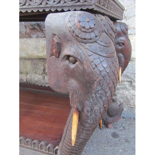 2630 - A 19th century Anglo Indian hardwood chest on stand, with rising lid and repeating carved foliate de... 