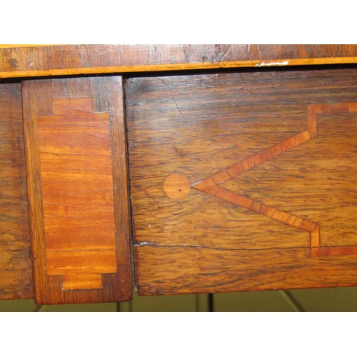 2575 - A Regency rosewood sofa table of usual form, with cross banded borders, raised on an open base with ... 