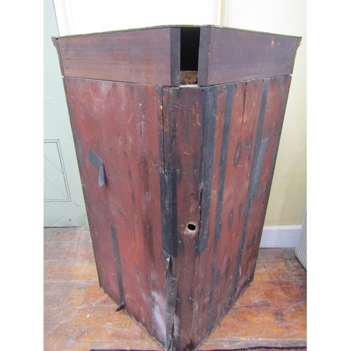 2588 - A Georgian mahogany hanging corner cupboard enclosed by a pair of panelled doors enclosing four shap... 