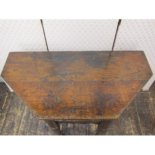 2594 - An old english oak credence or side table raised on turned forelegs with carved and repeating frieze... 