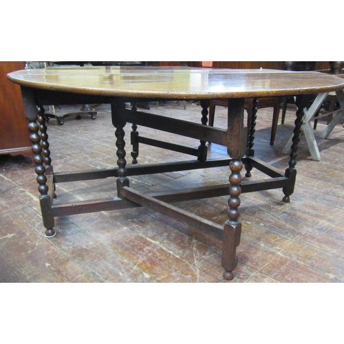 2623 - A large 18th century oak gateleg dining table raised on bobbin supports, 153cm long x 57cm wide (clo... 