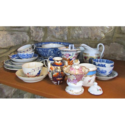 1066 - A miscellaneous collection of china to include a small imari vase, a large blue and white bowl, vari... 