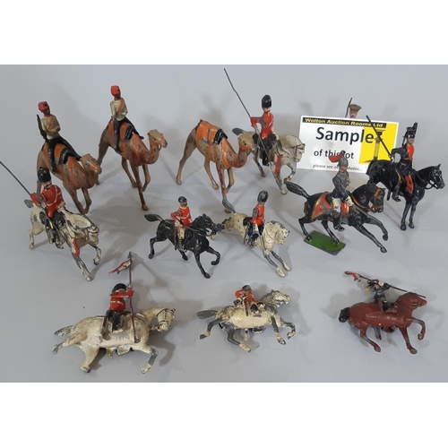 341 - Collection of Britains hollow lead painted figures including mounted soldiers, lancers, and guards, ... 