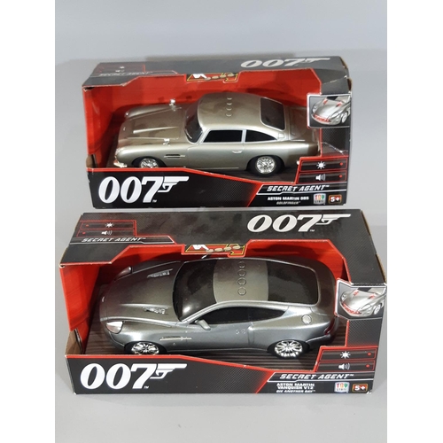 343 - Four boxed model cars including Burago Porsche 911 1994, two 007 Secret Agent Aston Martin from Die ... 