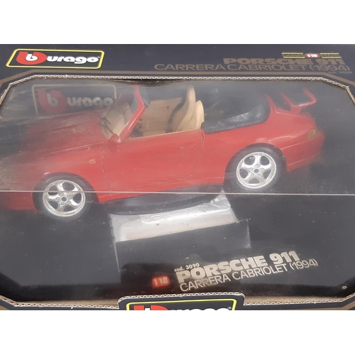 343 - Four boxed model cars including Burago Porsche 911 1994, two 007 Secret Agent Aston Martin from Die ... 