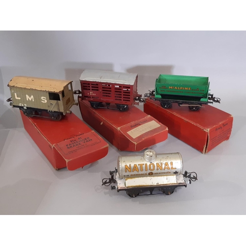 344 - A collection of Hornby O gauge clockwork railway locomotives, wagons and track including boxed Tank ... 